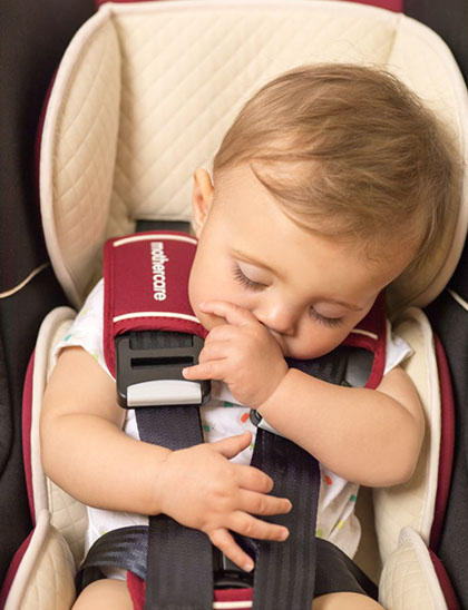 baby asleep in an i-size car seat
