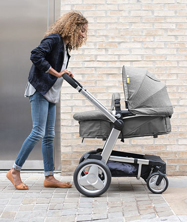 mum taking her baby out in a mothercare pushchair