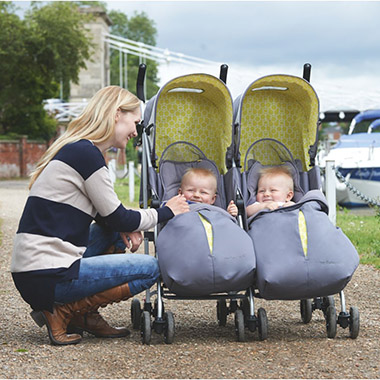 a mum with twin babies in a double pushchair