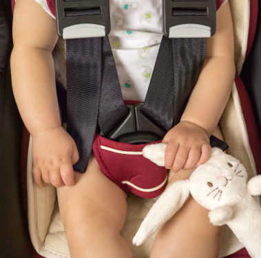 baby strapped in an i-size car seat