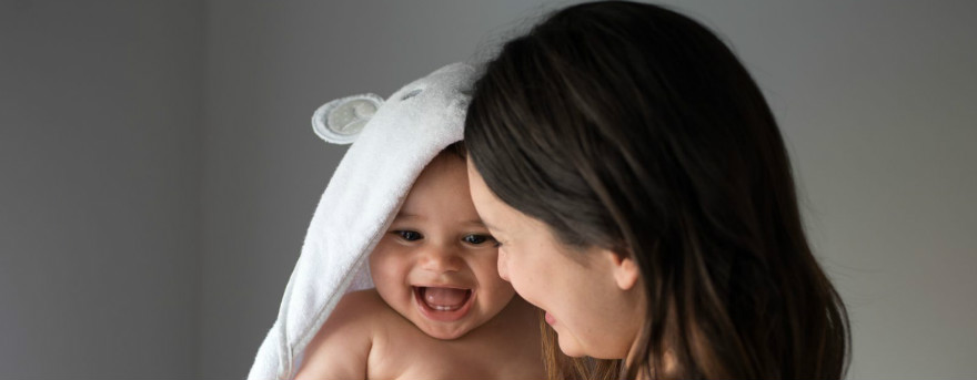 mum helping her baby learn through play