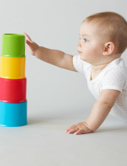 baby playing with a stacking toy